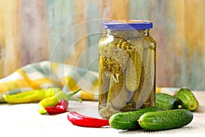 Homemade pickles in jar. Preserving pickled cucumbers.