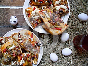 homemade pizza, cup of tea, eggs on the table