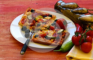 Homemade pizza with fresh tomatoes, peppers, olives, mushroom and cheese