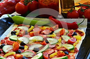 Homemade pizza with fresh tomatoes, peppers, olives, mushroom and cheese