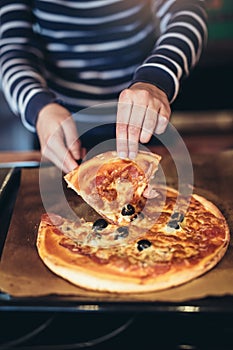 Homemade pizza lifted slice