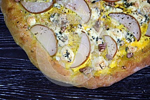 Homemade pizza with pear and walnuts. Dorblu pizza