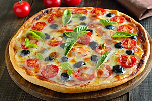 Homemade pizza with tomato and olives