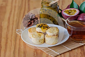 Homemade plain scones serve with homemade passion fruit jam. Scones is English pastry for afternoon tea,cream tea. Delicious