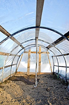 Homemade plastic arch empty greenhouse in winter