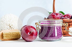 Homemade plum face and body scrub/foot soak/bath salt in a glass jar. DIY cosmetics and spa.