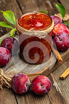 Homemade plum jam and fruits. vertical image. top view. place for text