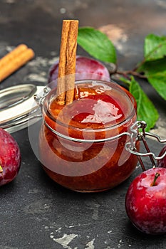 Homemade plum jam and fruits. vertical image. top view. place for text