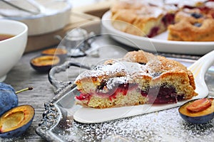 Homemade plum pie and cup of tea. New York Times recipe plum cake