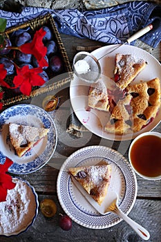 Homemade plum pie and cup of tea. New York Times recipe plum cake