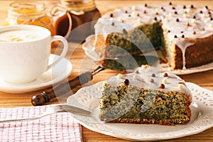 Homemade poppy seed cake and cup of coffee.