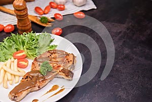 Homemade pork chop steak with salad. Online learning for cooking diet and healthy food when stay at home