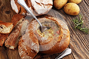 Homemade potato cream soup, served in bread bowl