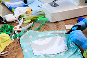 Homemade protection textil face, nose and mouth mask against virus . Sewing protective face masks at home during a covid-19