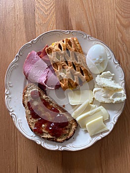 Homemade Protein Breakfast Plate with Ham, Boiled Egg, Buttercream, Peanut butter, Cheese, Jam Marmalade and Toasted Bread