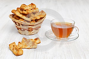 Homemade puff pastry. Plait cookies and cup of tea.