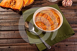 Homemade pumpkin cream, accompanied by spices. pumpkin broth photo