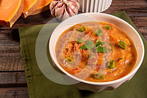 Homemade pumpkin cream, accompanied by spices. pumpkin broth photo