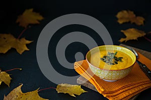 Homemade pumpkin cream soup with seeds