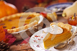 Homemade pumpkin pie on a rustic table