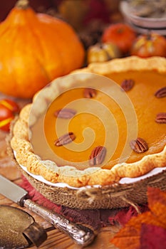 Homemade pumpkin pie on a rustic table