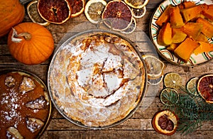 Homemade pumpkin pie and various ingredients