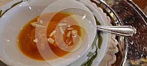 Homemade pumpkin soup with almond slivers