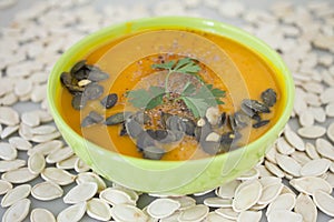 Homemade pumpkin soup and pumpkin seeds