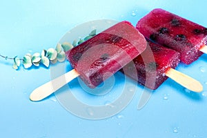 Homemade Raspberry and blueberry ice cream top view on blue background summer, desser,food concept modern design with