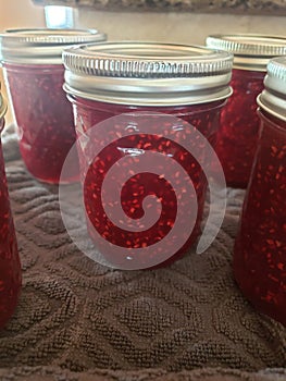 Homemade raspberry jam canned in jars