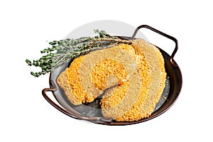 Homemade raw breaded German Weiner Schnitzel. Isolated on white background.