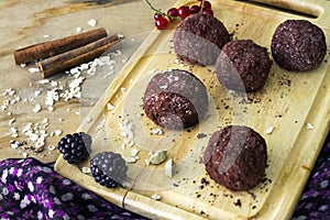 Homemade raw healthy vegan chocolate truffles with muesli.
