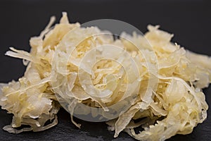 Homemade raw sauerkraut on a slate plate