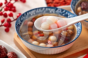 Homemade red and white tangyuan with syrup soup, dried longan pulp, red dates for Winter solstice