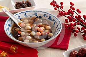 Homemade red and white tangyuan with syrup soup, dried longan pulp, red dates for Winter solstice