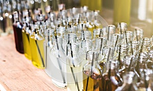 Homemade refreshing drinks in bottles on counter