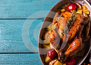 Homemade Roasted Thanksgiving Day Turkey on bright blue wooden background.