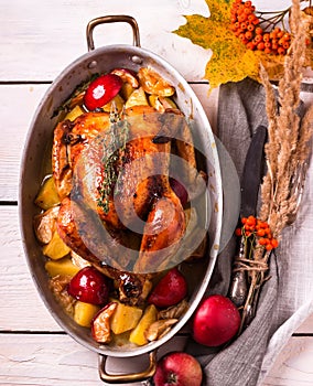 Homemade Roasted Thanksgiving Day Turkey on white wooden background.