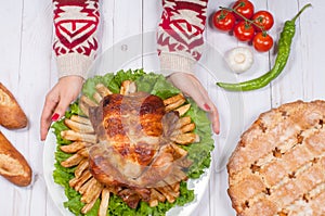 Homemade roasted whole turkey on wooden table for Thanksgiving.