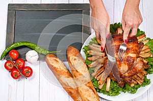 Homemade roasted whole turkey on wooden table for Thanksgiving.