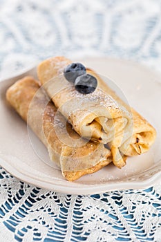 Homemade rolled pancakes with blueberry
