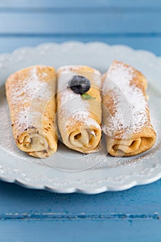 Homemade rolled pancakes with blueberry