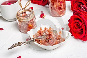 Homemade rose petals jam in bowl and glass jar