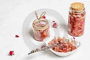 Homemade rose petals jam in bowl and glass jar