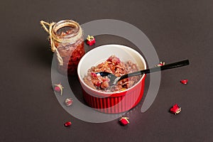 Homemade rose petals jam in bowl and glass jar