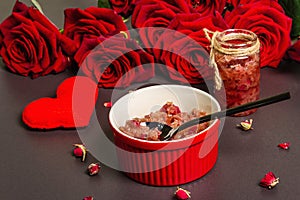 Homemade rose petals jam in bowl and glass jar