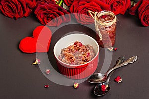 Homemade rose petals jam in bowl and glass jar