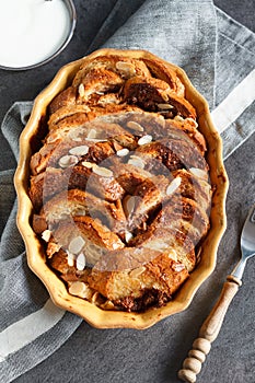 Homemade rustic bread pudding with chocolate and almonds