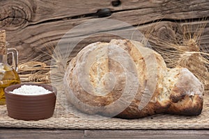 Homemade rustic bread on wooden background