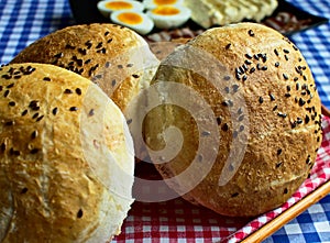 Homemade rustic buns on a table photo